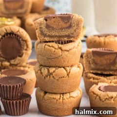 Half of a Reese’s Peanut Butter Cup Cookie stacked on top of three Reese’s Peanut Butter Cup Cookies