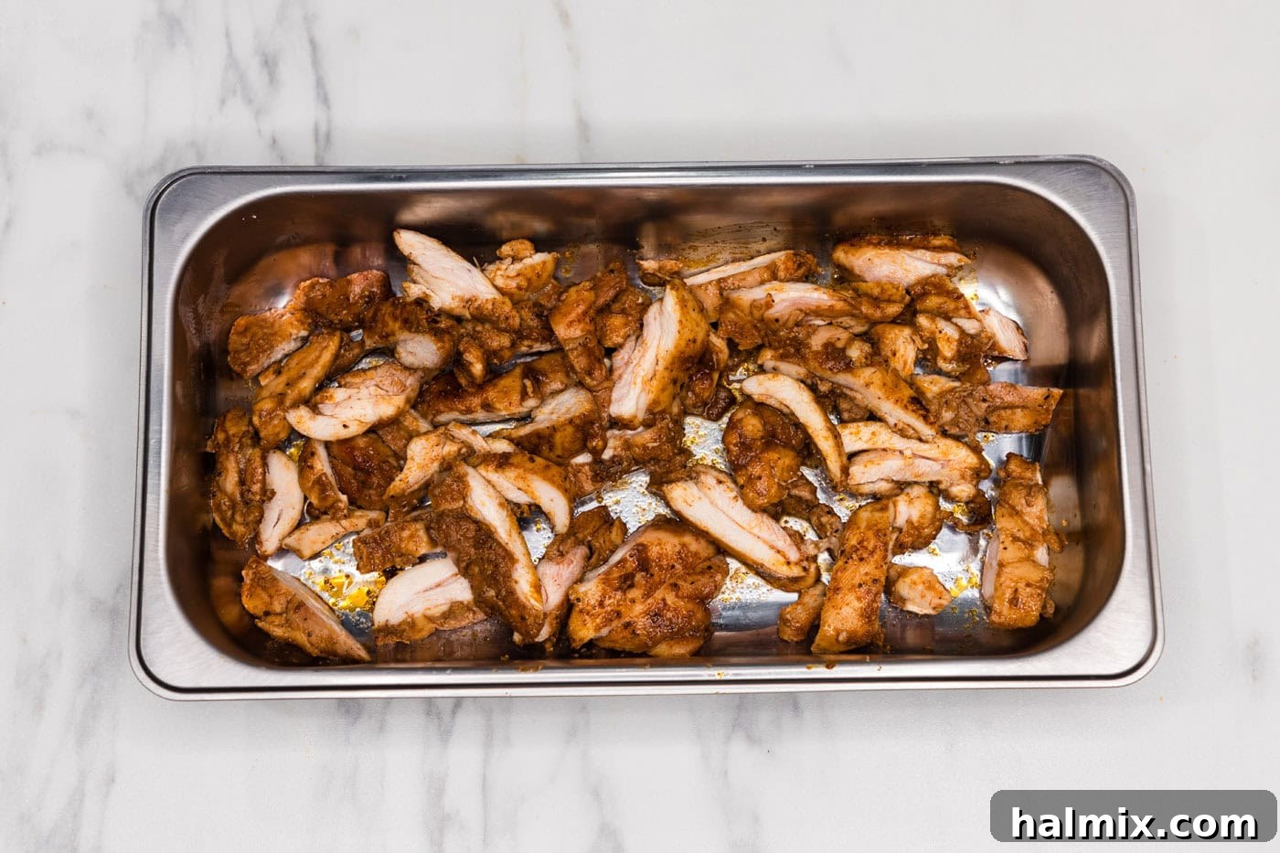 sliced chicken in a pan