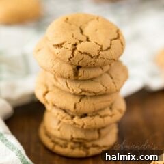 Stack of freshly baked gingersnap cookies, ready to be enjoyed.
