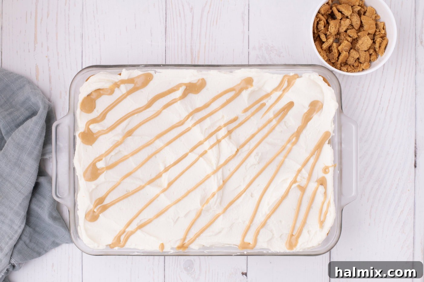 Nutter Butter Dream Cake 11 peanut butter drizzle over no bake nutter butter icebox cake in a pan