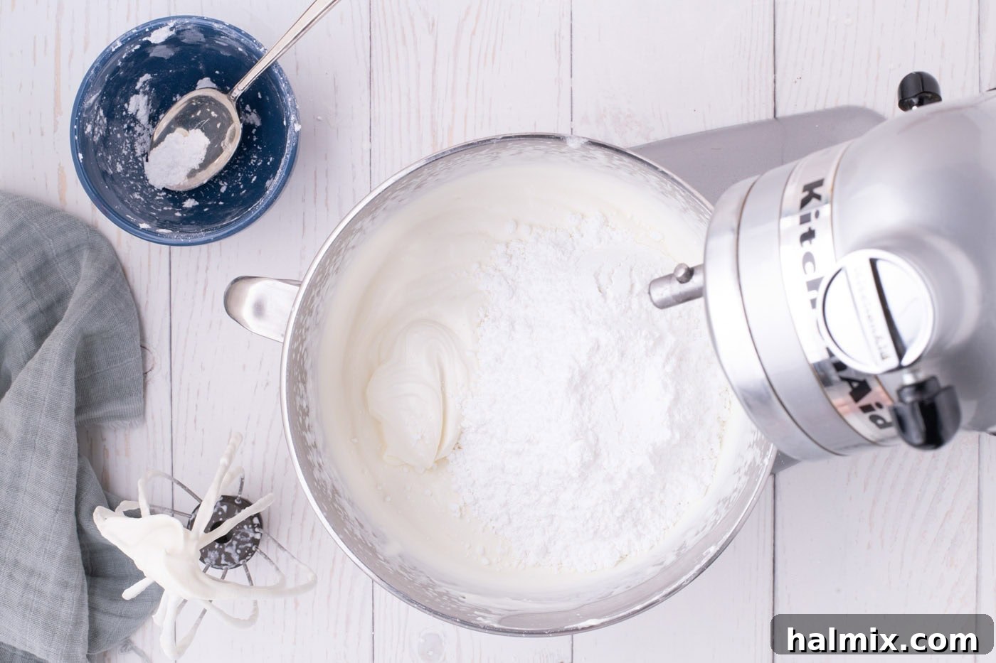 Nutter Butter Dream Cake 6 heavy cream, cream cheese, vanilla, and powdered sugar added to a stand mixer bowl