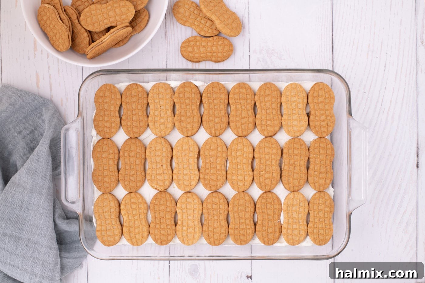 Nutter Butter Dream Cake 8 nutter butter cookies in a baking dish on top of whipped cream