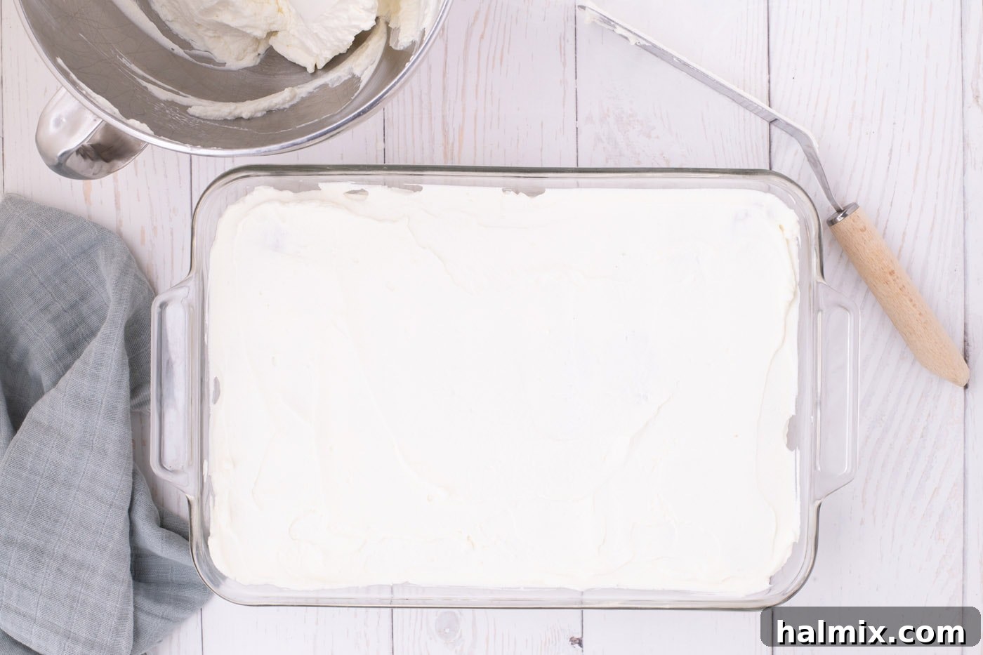 Nutter Butter Dream Cake 9 whipped cream layer over nutter butter cookies in a dish