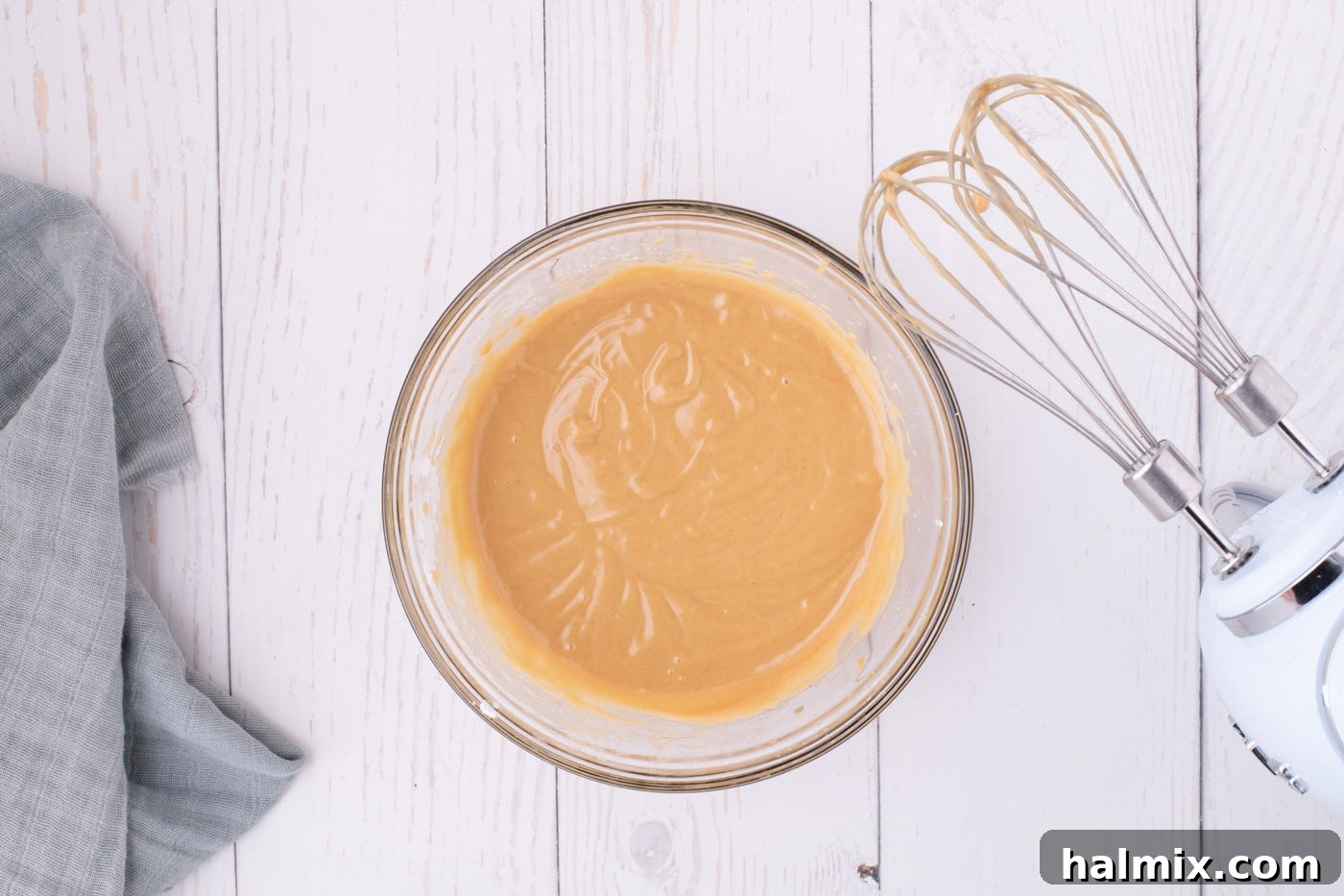 Nutter Butter Dream Cake 10 peanut butter, powdered sugar, vanilla, and water mixture in a bowl