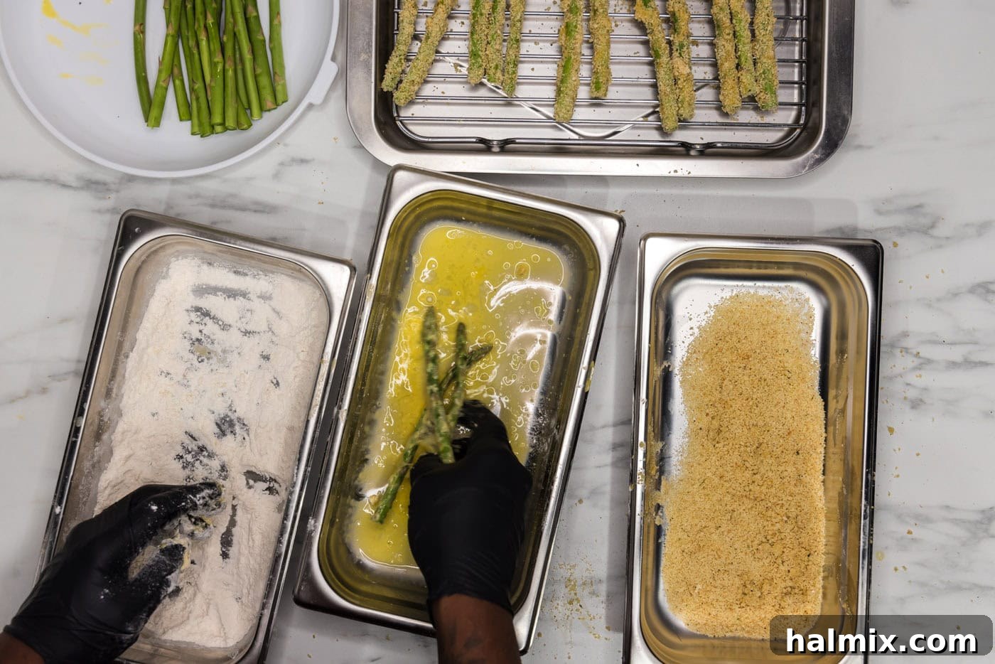 Crispy Air Fryer Asparagus 5 dredging asparagus spears in egg