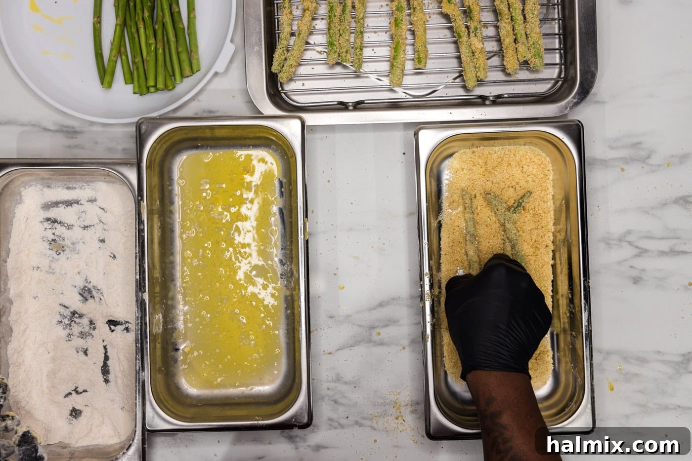 Crispy Air Fryer Asparagus 6 dredging asparagus spears in breadcrumb mixture