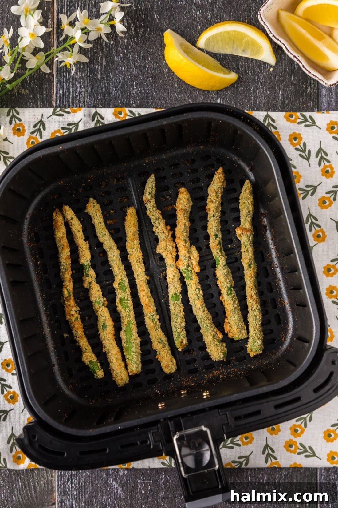 Crispy Air Fryer Asparagus 9 Air Fryer Fried Asparagus in an air fryer basket