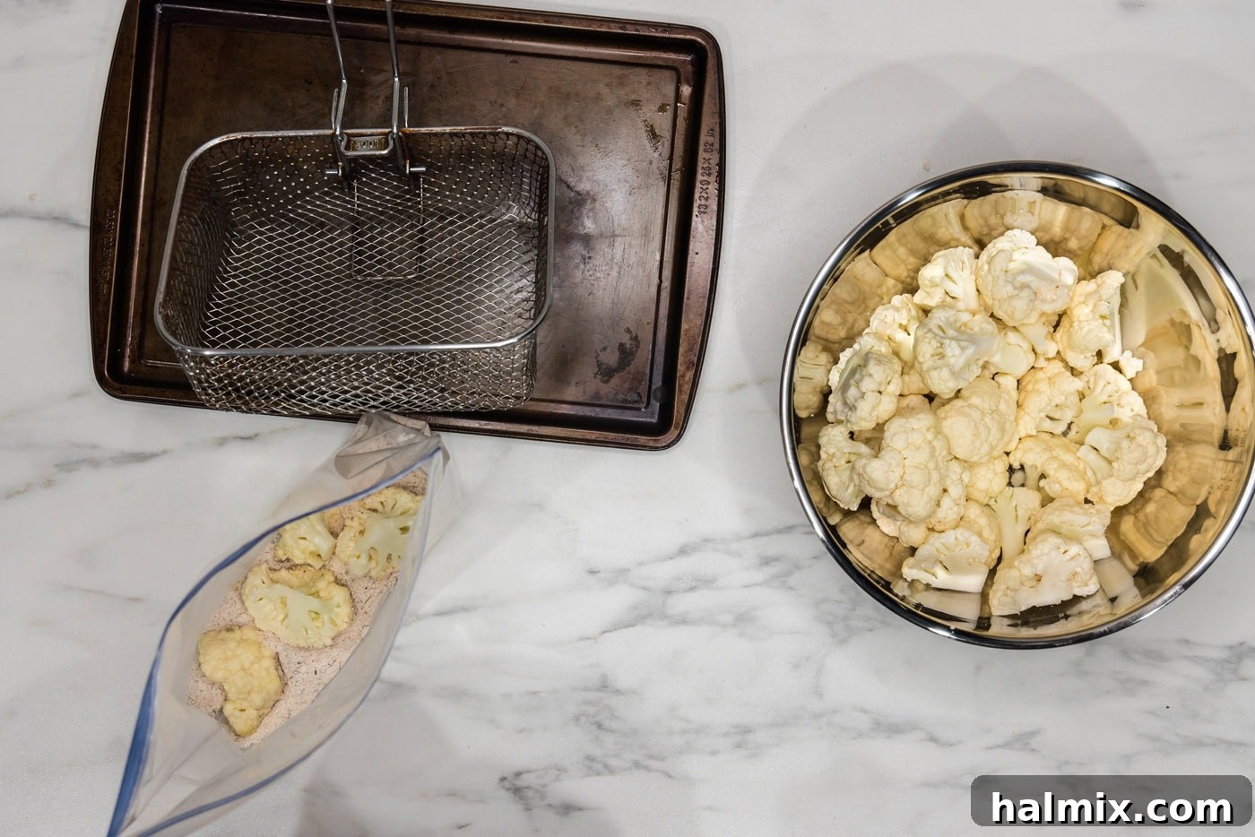 Crispy Golden Cauliflower 9 Cauliflower florets being dredged in a bag filled with seasoned flour mixture, ensuring an even coating