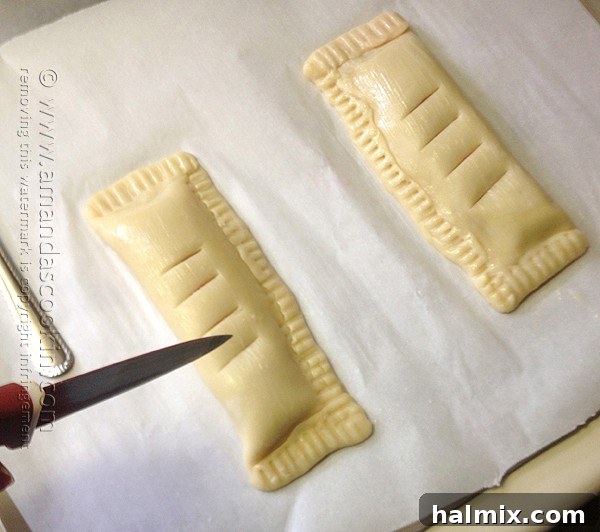 Homemade McDonald's Style Cherry Pie 12 Step-by-step: Cutting steam vents and sprinkling sugar on cherry hand pies