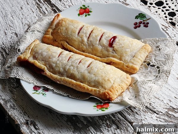 Homemade McDonald's Style Cherry Pie 14 Two golden-brown McDonald's-style cherry hand pies on a plate