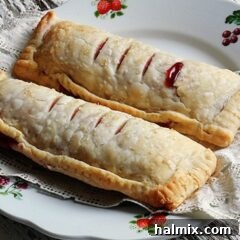 A close up photo of two McDonalds cherry pie copycats on a plate.