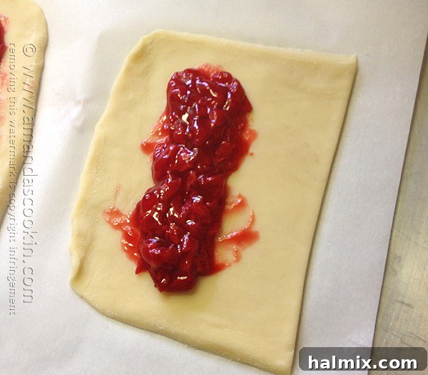 Homemade McDonald's Style Cherry Pie 9 Step-by-step: Folding dough lengthwise to encase the cherry filling