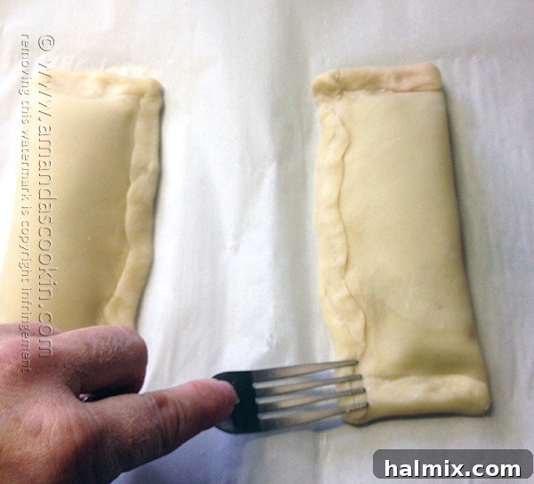 Homemade McDonald's Style Cherry Pie 10 Step-by-step: Sealing hand pie edges with the tines of a fork