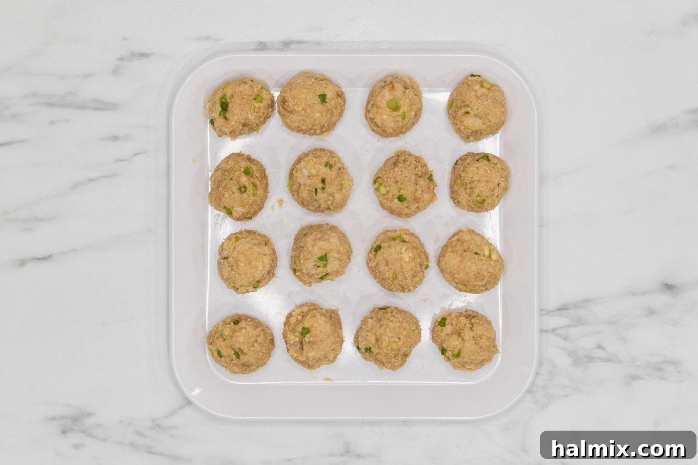 Asian inspired chicken meatballs in a tray