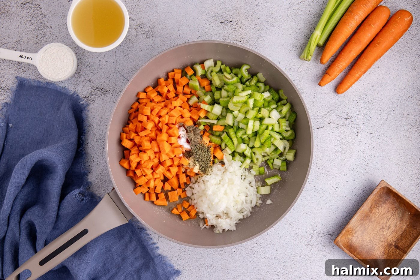 Easy Chicken Pot Pie Bake 5 carrots, celery, and onion in a skillet