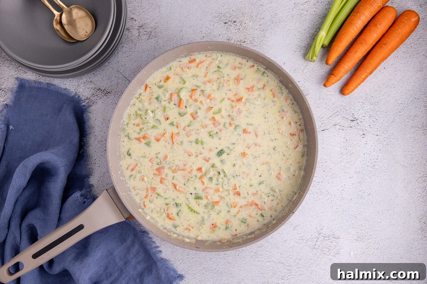 Easy Chicken Pot Pie Bake 8 milk and chicken stock added to pot pie mixture in a skillet