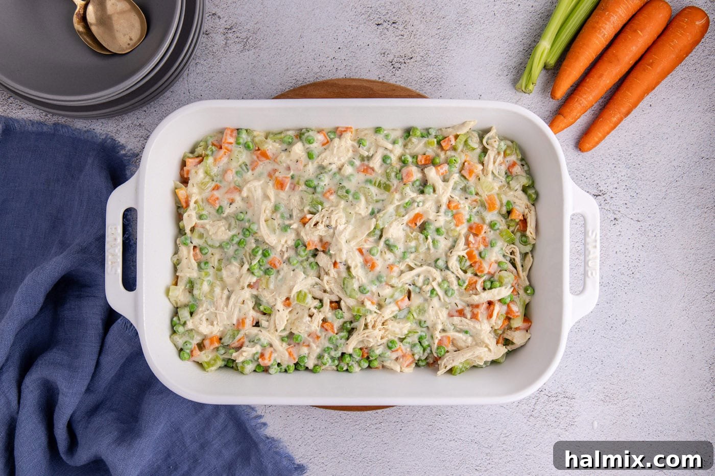 Easy Chicken Pot Pie Bake 10 chicken pot pie filling in a casserole dish