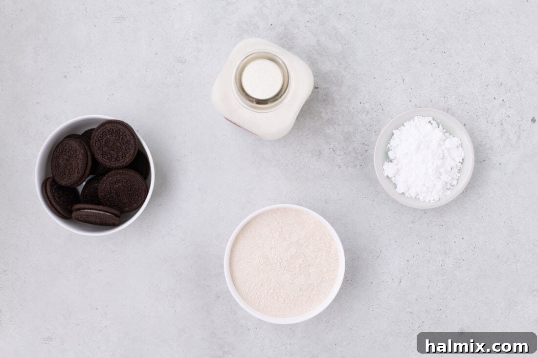 Air Fryer Oreo Magic 4 Ingredients for Air Fryer Oreos laid out: pancake mix, milk, Oreos, and powdered sugar