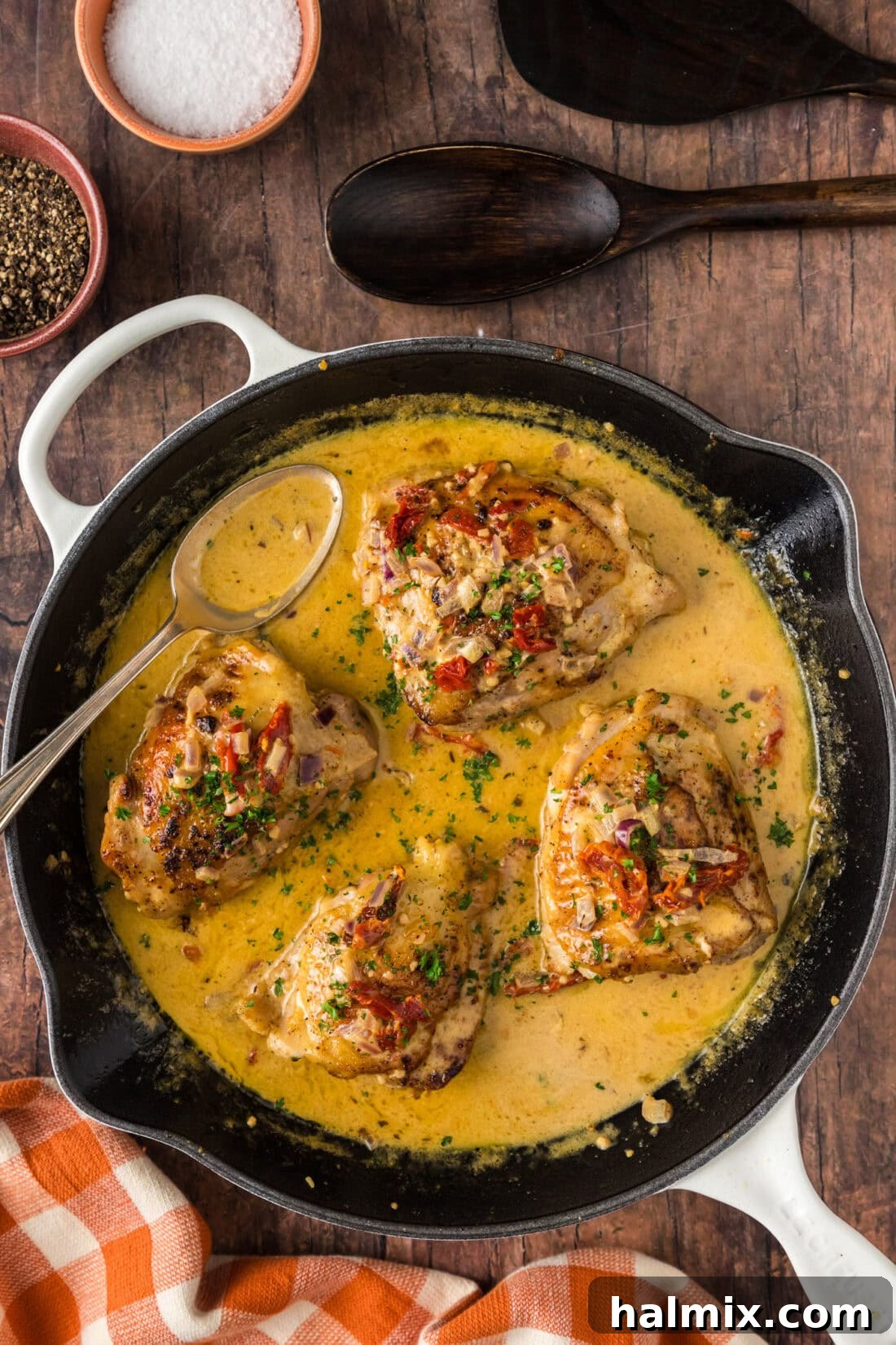 Overhead photo of Skillet Chicken Thighs with fresh parsley garnish