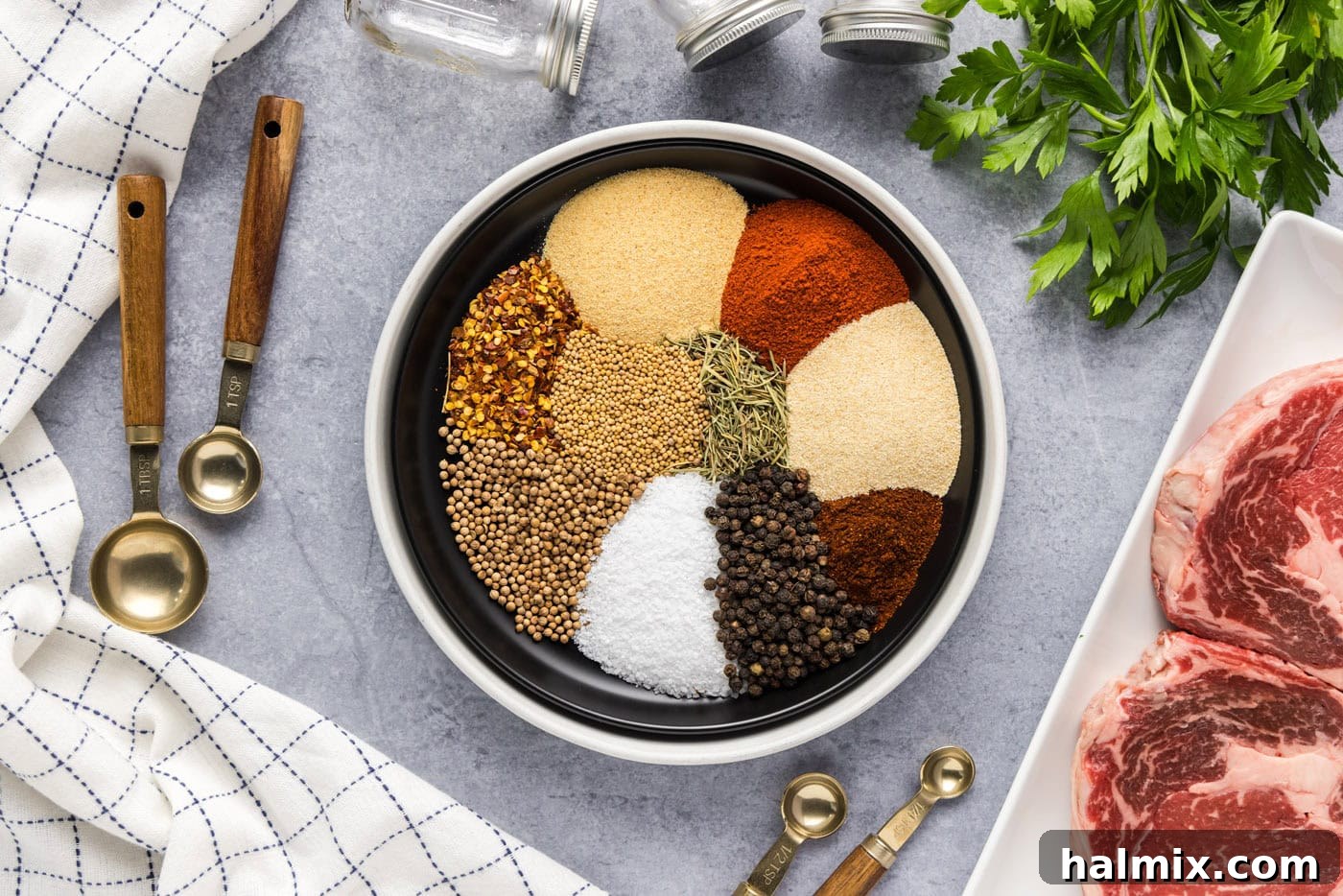 spices and herbs spooned into a bowl neatly