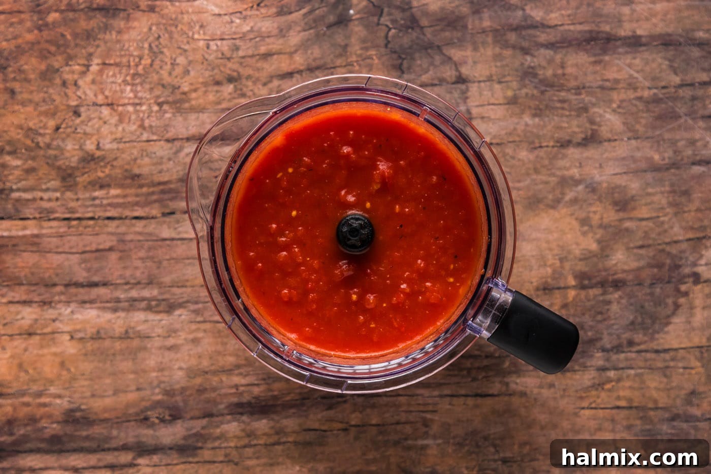 Smooth tomato sauce in a food processor, after blending.