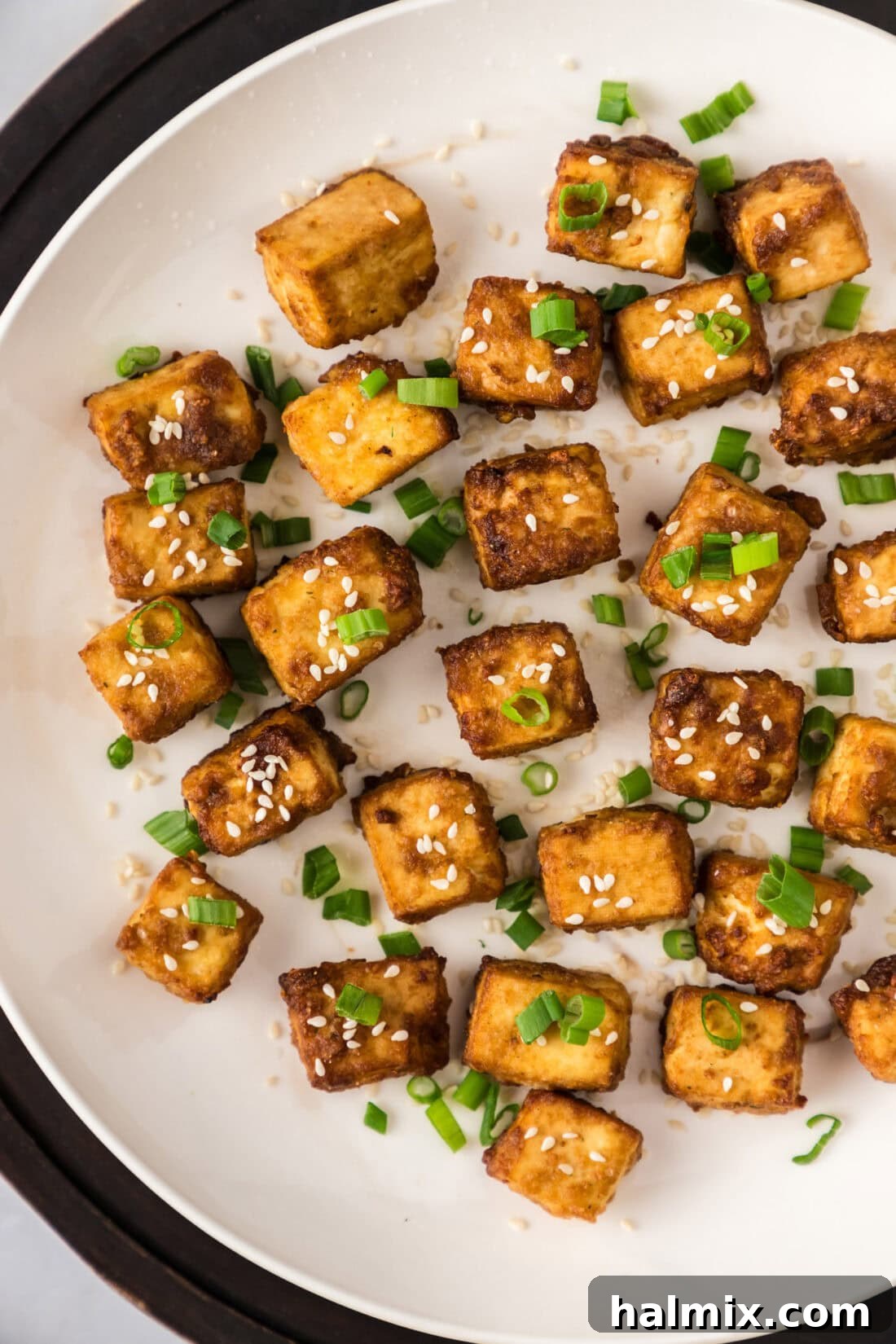 Unbelievably Crispy Air Fryer Tofu 2 Close up photo of a plate of Air Fryer Tofu