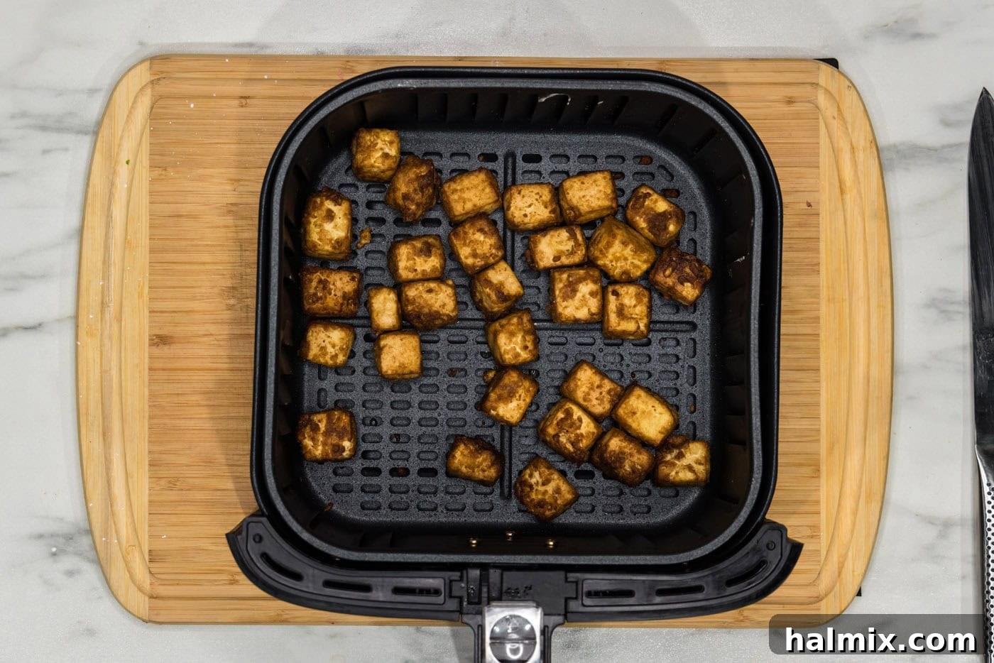 Unbelievably Crispy Air Fryer Tofu 10 air fried tofu in air fryer basket