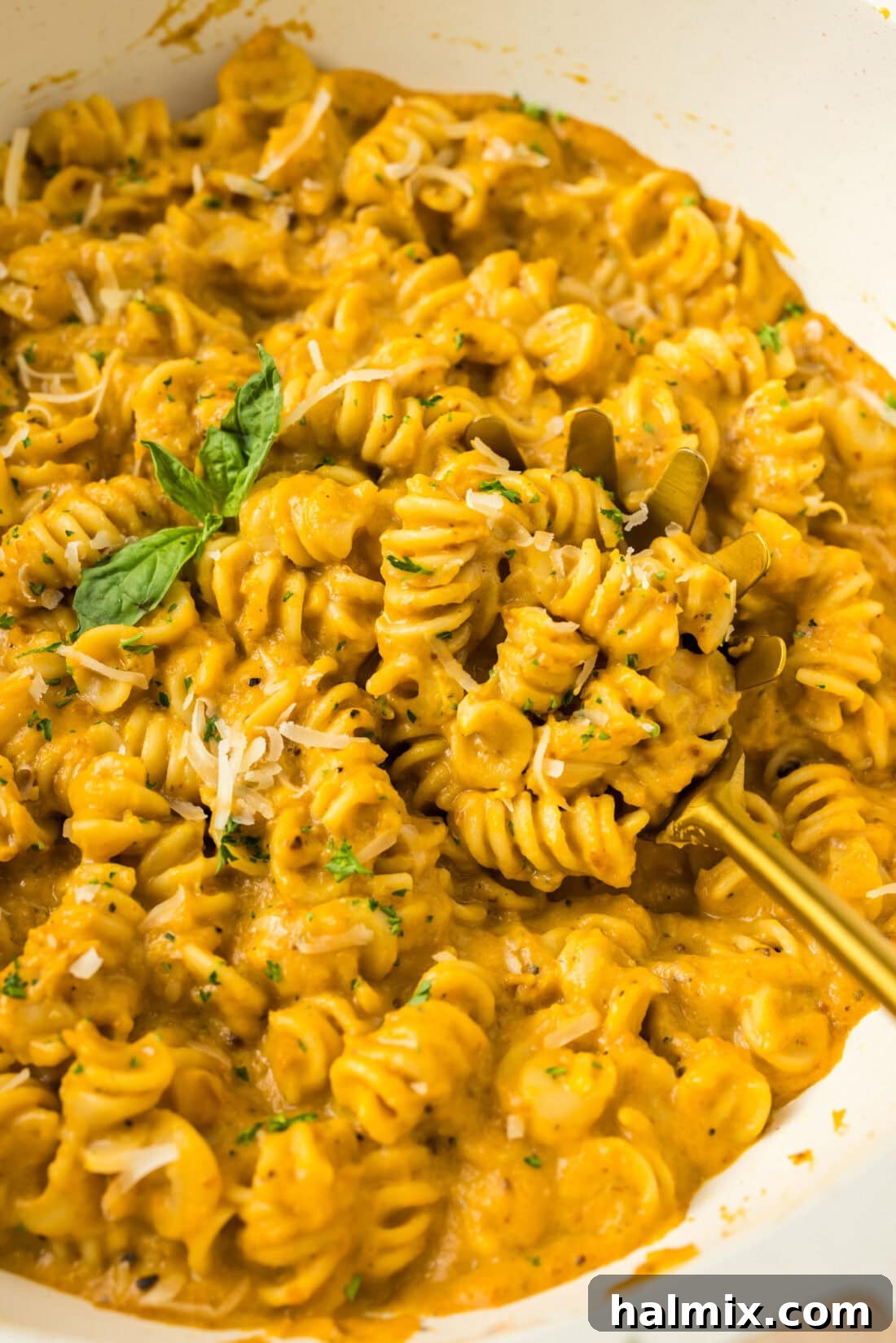 Velvety Butternut Squash Pasta 2 Close up photo of Butternut Squash Pasta in a skillet with a spoon