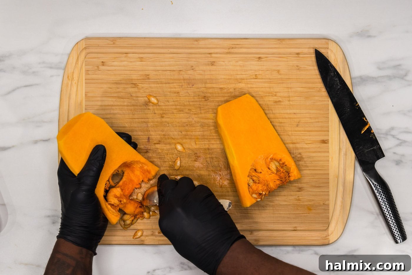 Velvety Butternut Squash Pasta 6 deseeding butternut squash on a cutting board
