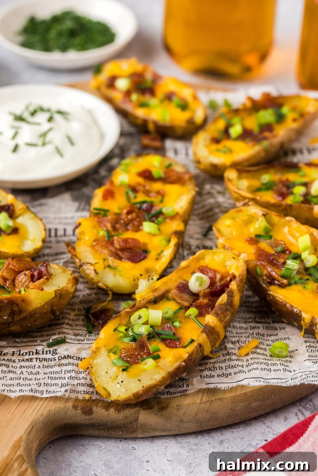 Loaded Potato Skins 2 Close up photo of Potato Skins on a wooden platter
