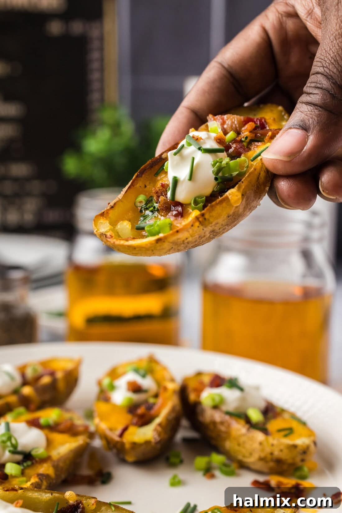 Loaded Potato Skins 3 Hand holding up a Potato Skin