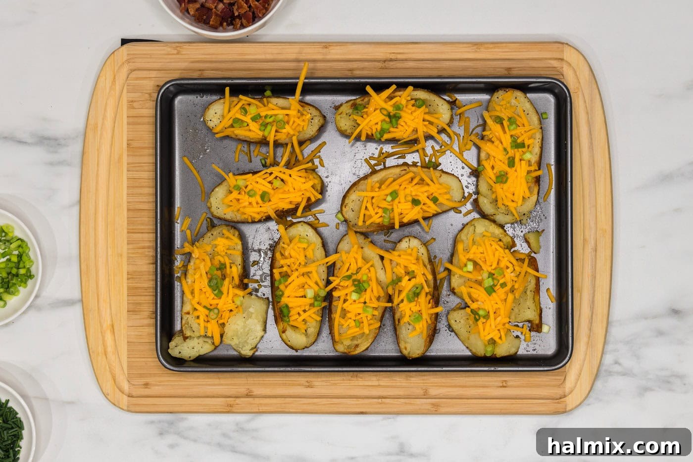 Loaded Potato Skins 9 shredded cheese, green onions, and chives on top of potato skins
