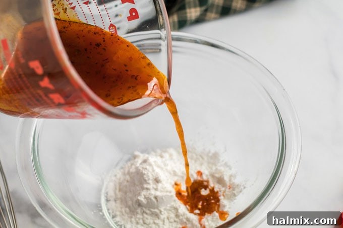 adding broth to cornstarch