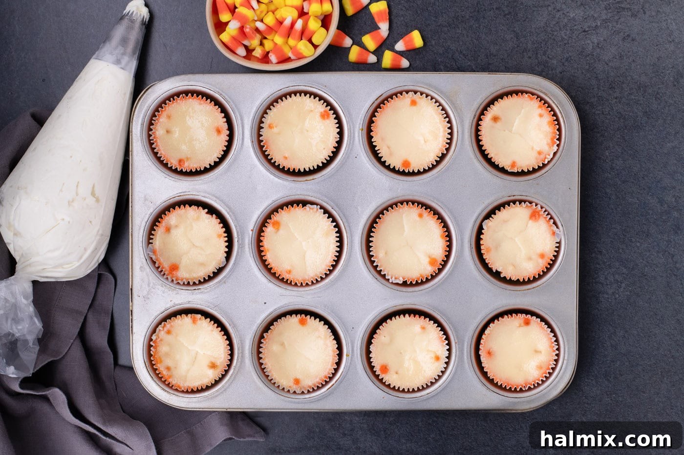 Spooky Sweet Candy Corn Cheesecake Minis 11 Cooled mini candy corn cheesecakes still in the cupcake pan after slow cooling.