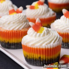 Close up photo of Mini Candy Corn Cheesecakes on a white platter