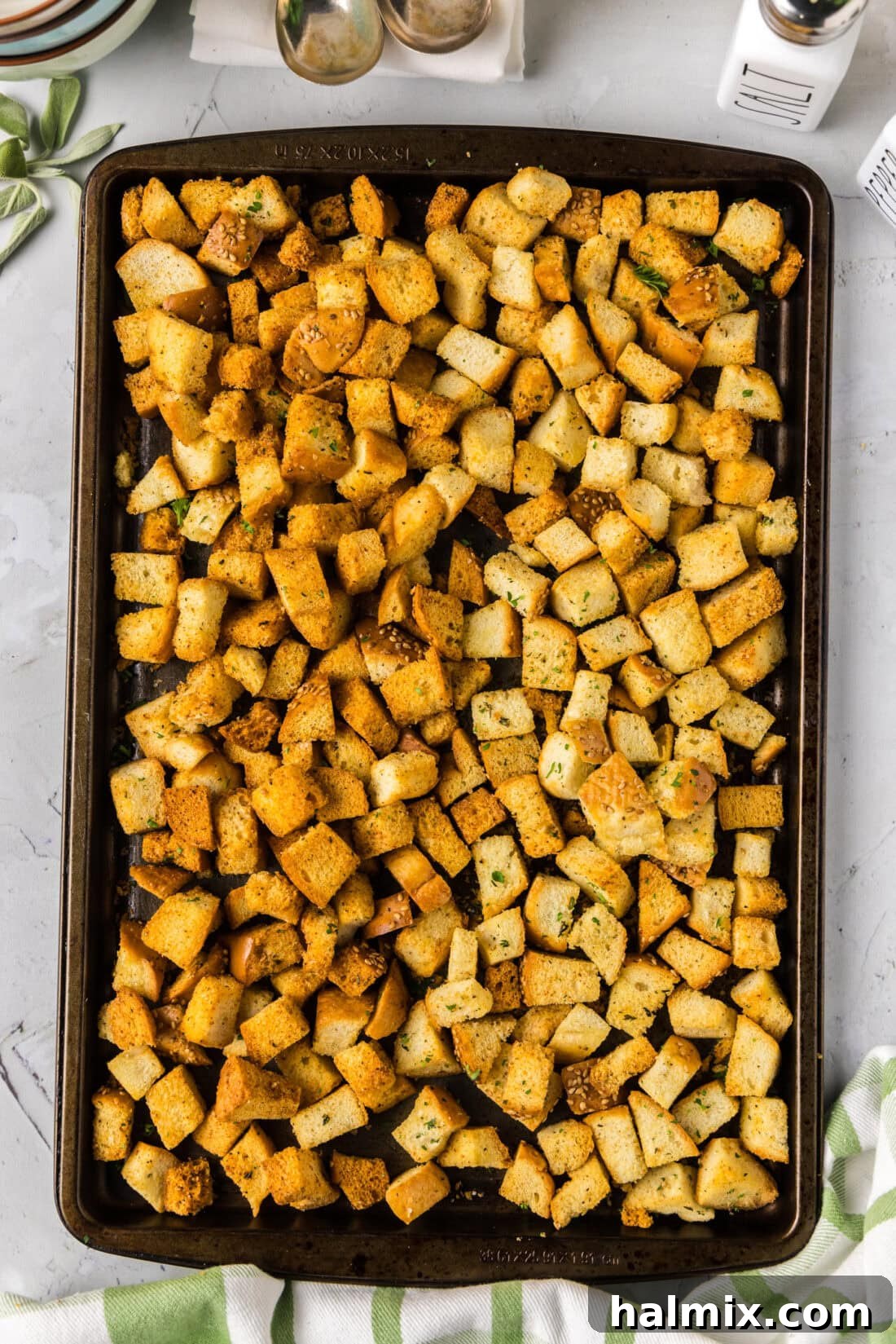 Baking sheet of dark and light Homemade Croutons unmixed