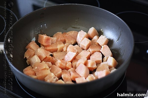 A vibrant photo of the Chicken with Peppers and Pasta cooking in a large skillet, ready to be served.