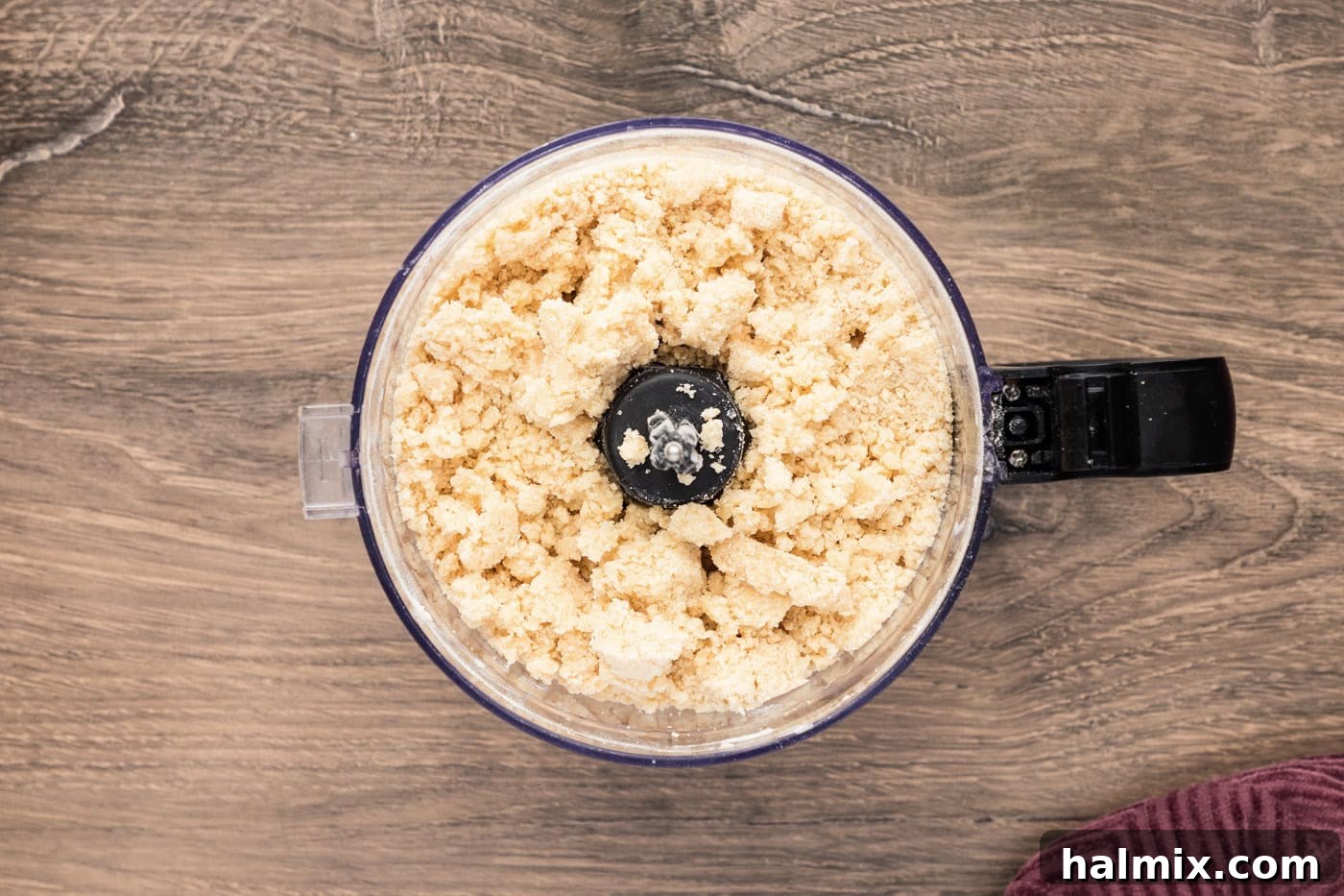 Crumb mixture forming in a food processor, ready for the crust