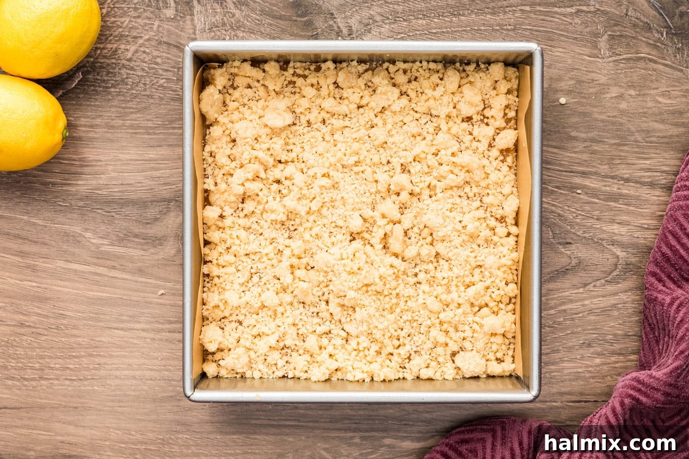 Remaining crumb mixture sprinkled over the lemon curd as the streusel topping