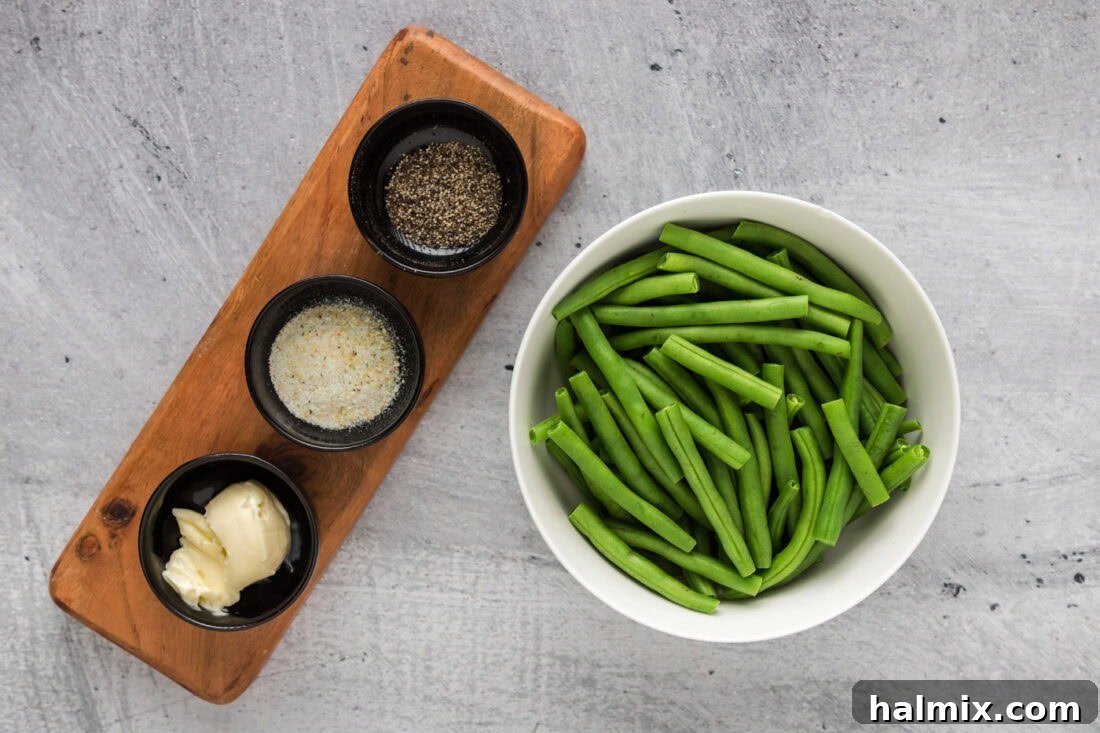 Quick and Perfect Instant Pot Green Beans 4 A flat lay photograph showcasing fresh green beans, butter, garlic salt, and black pepper, the core ingredients for Instant Pot Green Beans.