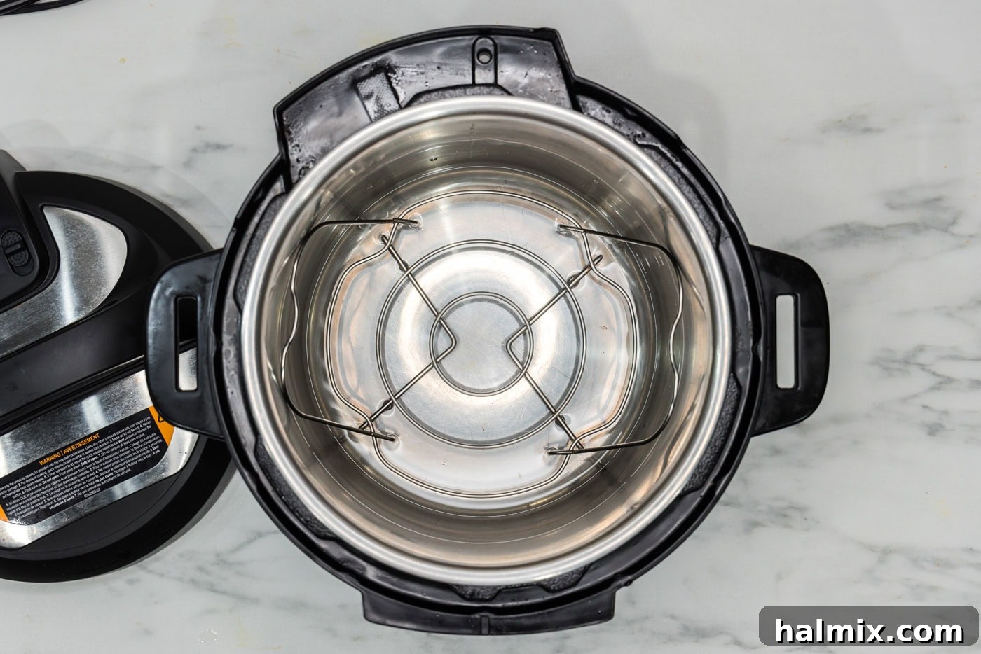 Quick and Perfect Instant Pot Green Beans 5 Water in Instant Pot with trivet inserted, ready for green beans.