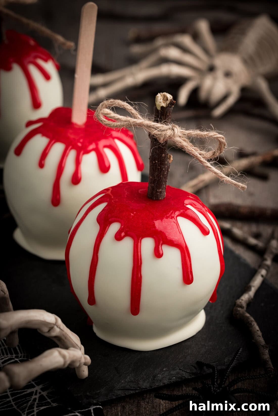 Three Bloody Candy Apples lined up in a row, a perfect Halloween dessert