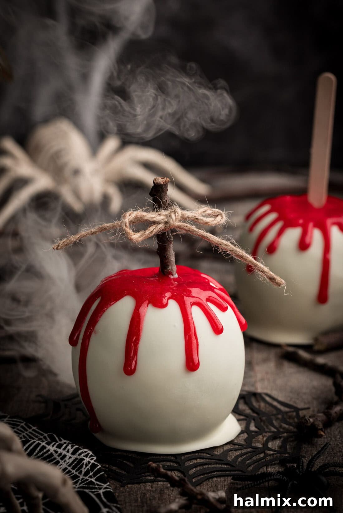 Bloody Candy Apple with smoke behind it, enhancing the spooky Halloween atmosphere