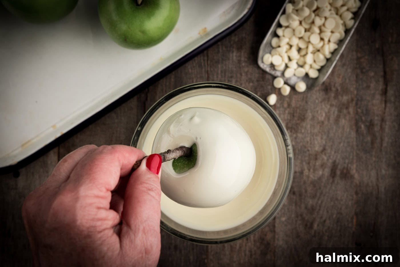 white chocolate coated apple on a stick