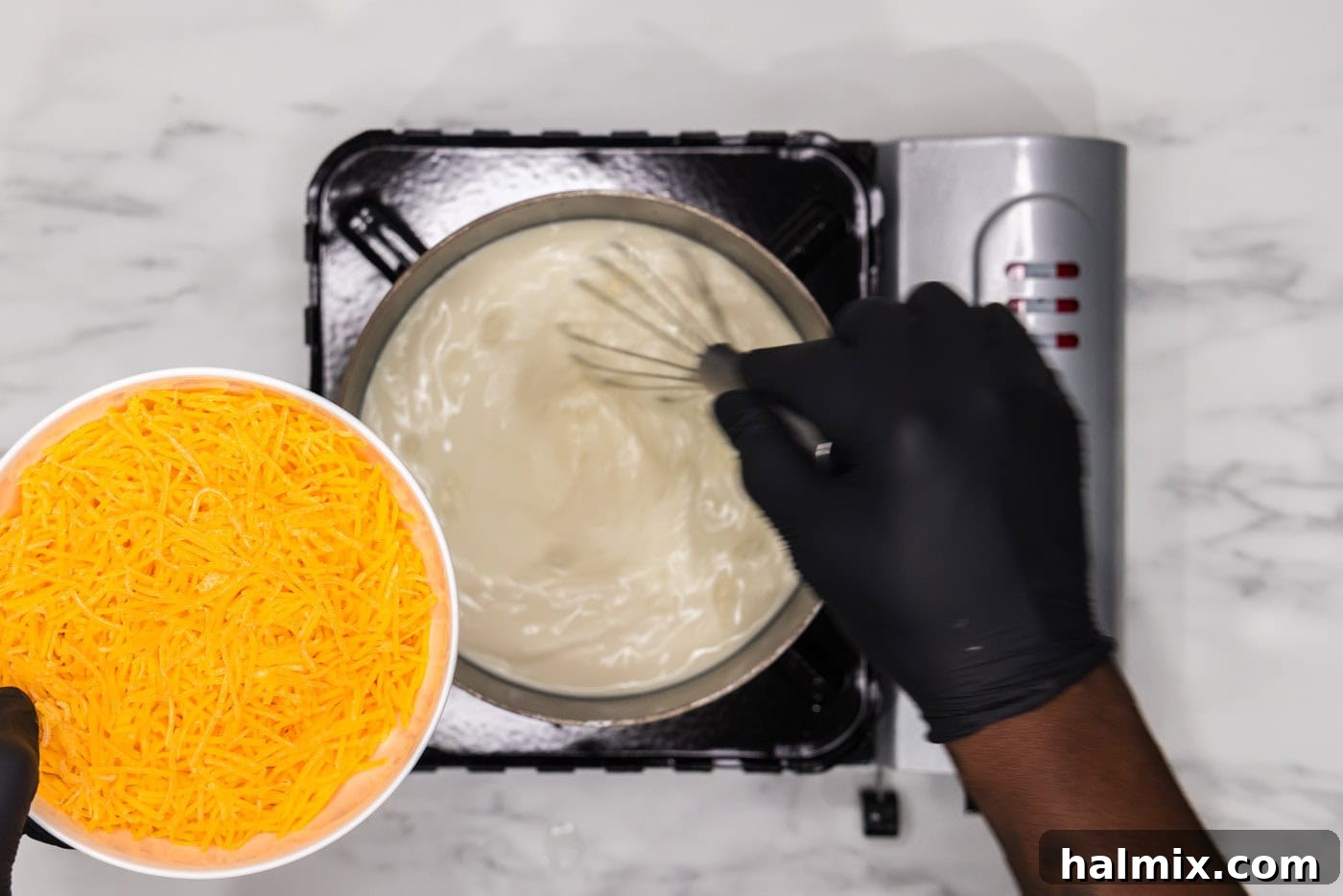 Rich and Creamy Slow Cooker Scalloped Potatoes 8 whisking heavy whipping cream mixture in a saucepan while adding cheese