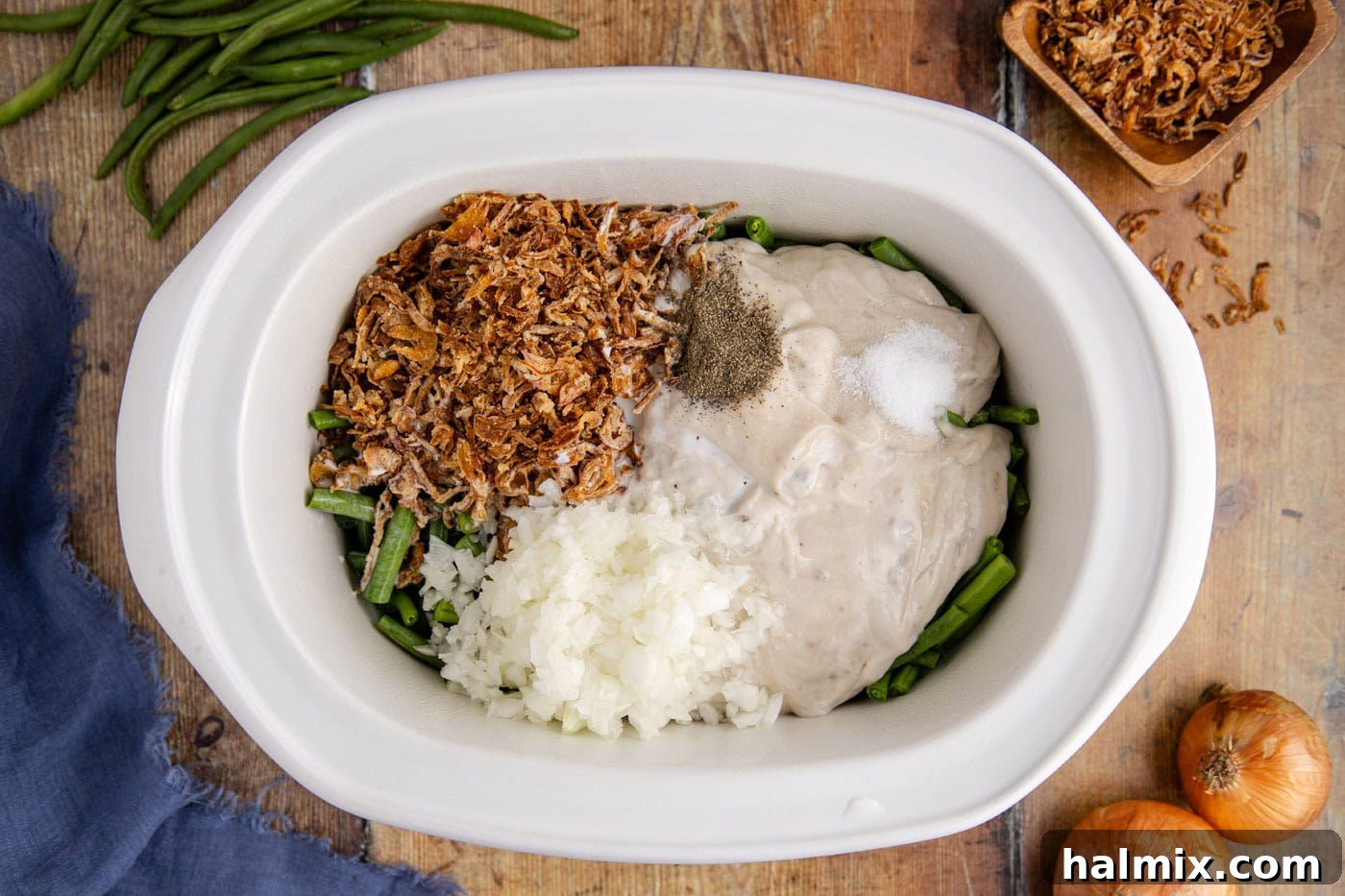 all green bean casserole ingredients mixed in a crockpot before cooking