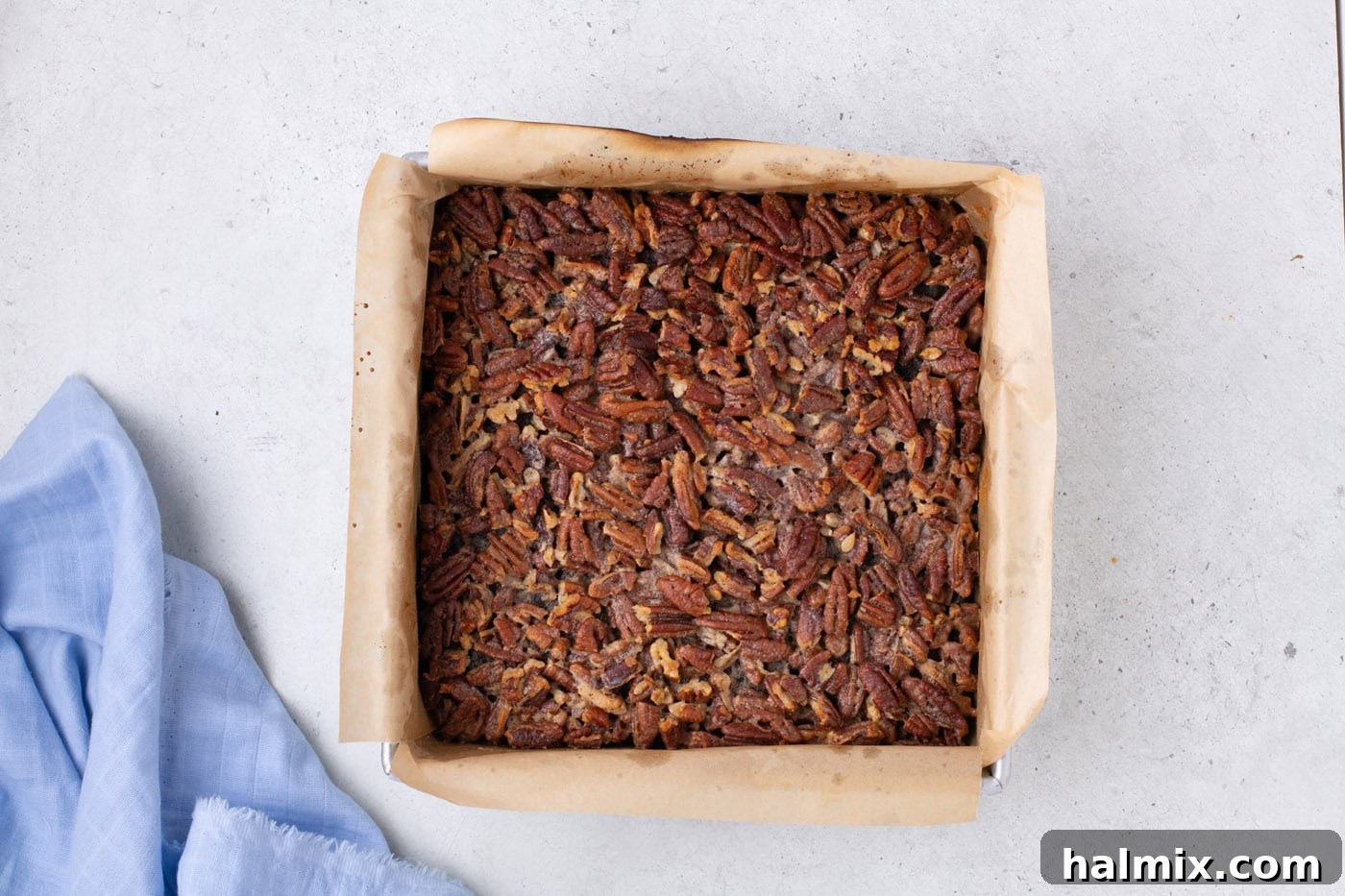 baked pecan pie brownies in a baking pan