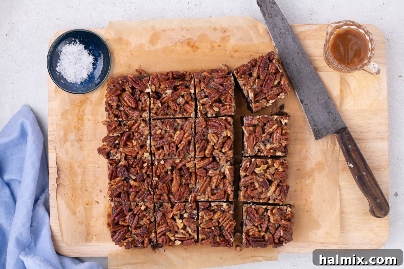 pecan pie brownies cut into squares on a baking sheet