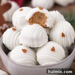 Bowl of Gingerbread Oreo Truffles with a bite taken out of one