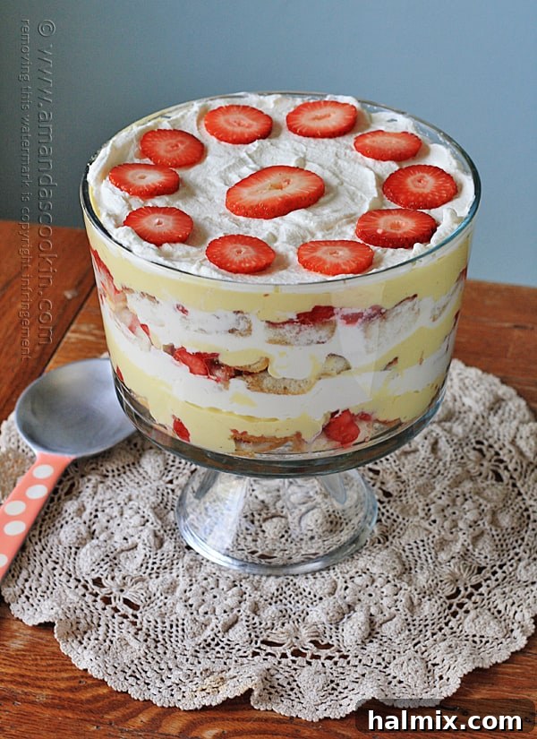 A piece of cake sitting on top of a wooden table, ready for trifle preparation